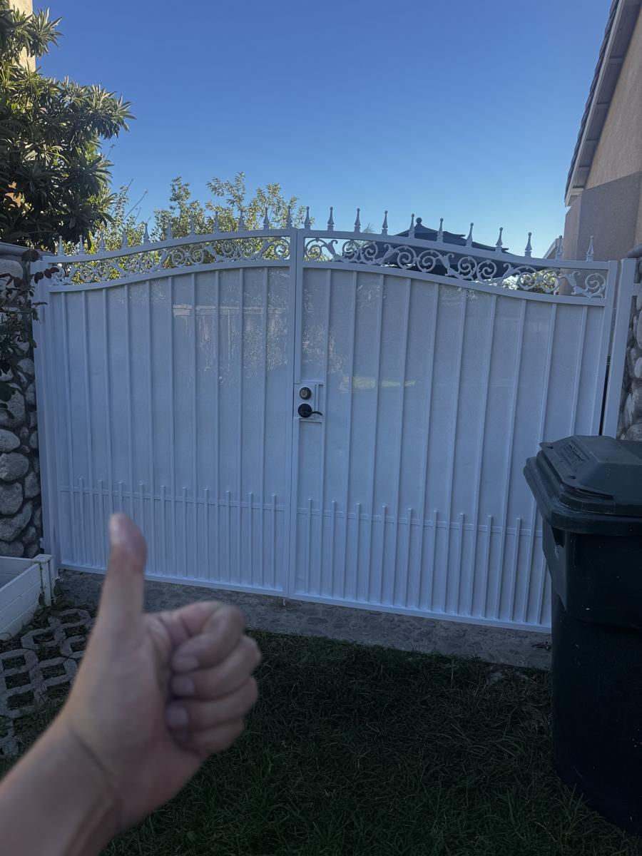 Same gate after repainting, clean white finish
