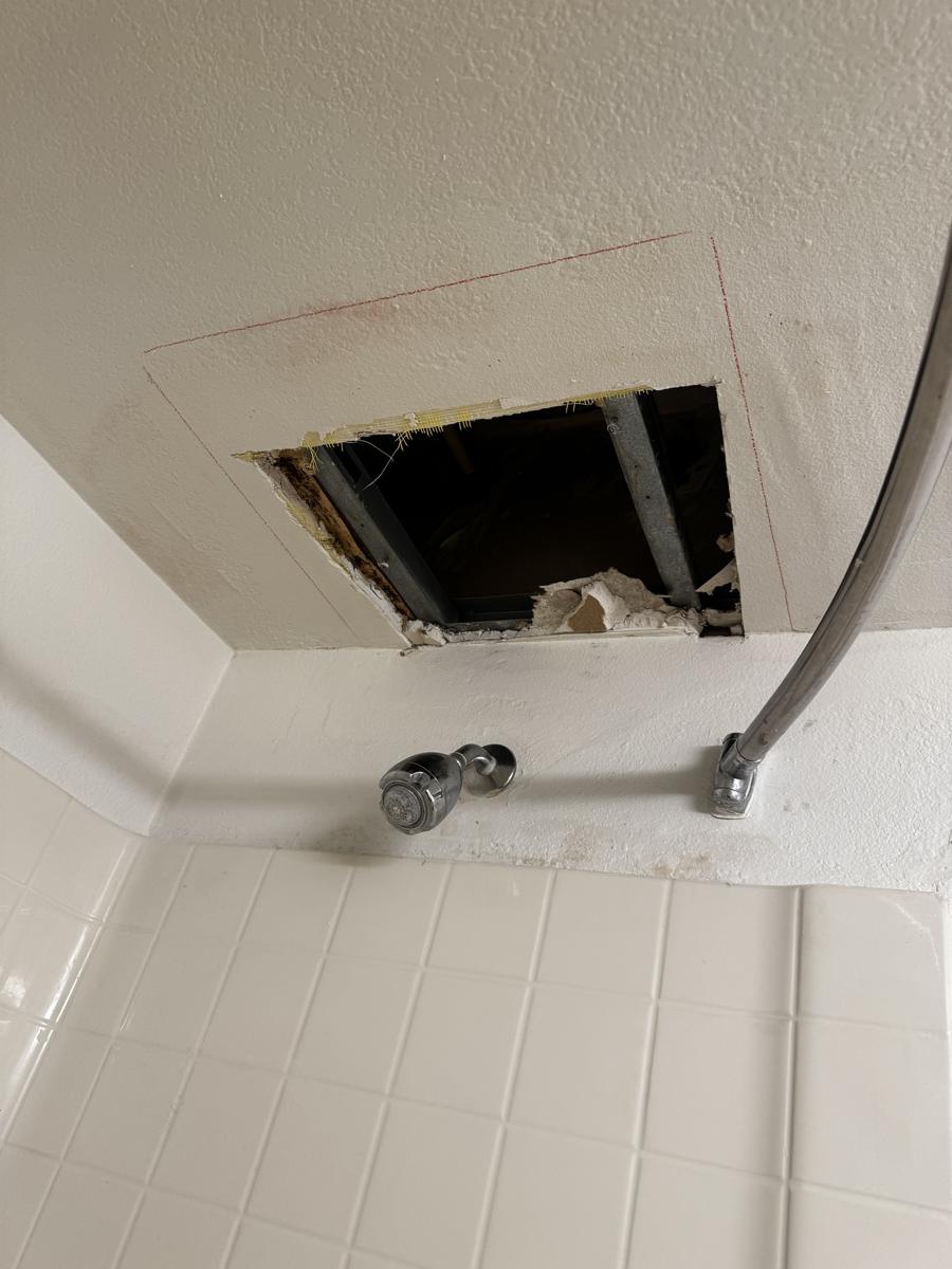 Ceiling opened up to find and dry out a leak
